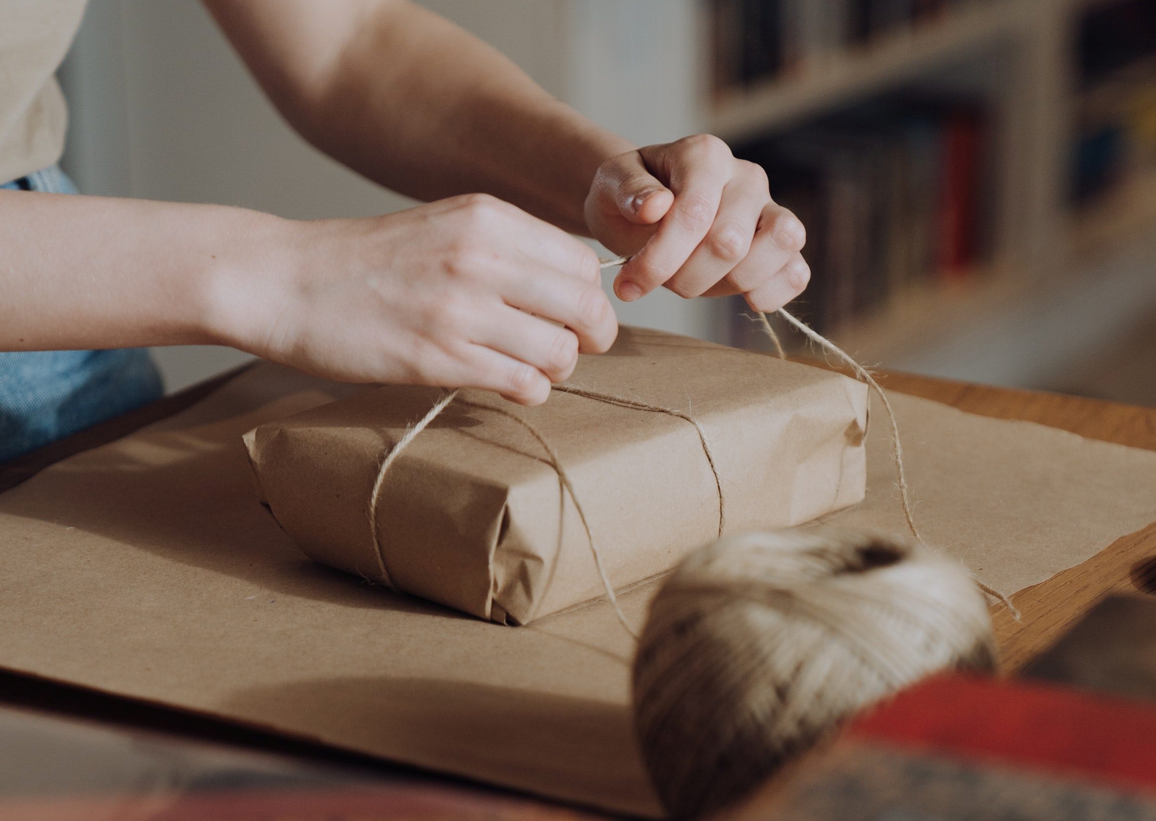 female wrapping a package